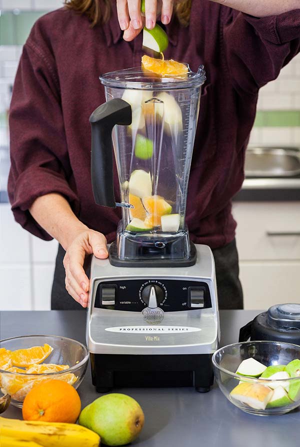 Dropping fruit in a blender