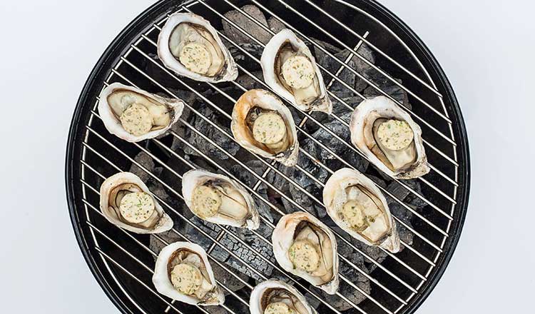 Grilling oysters with butter