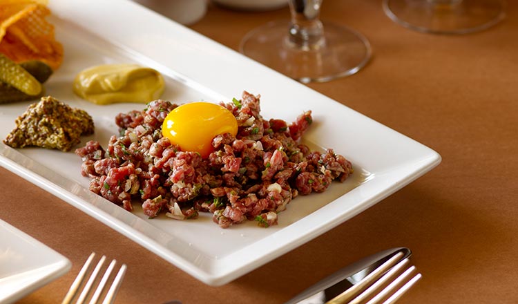 Steak tartare with a raw egg yolk