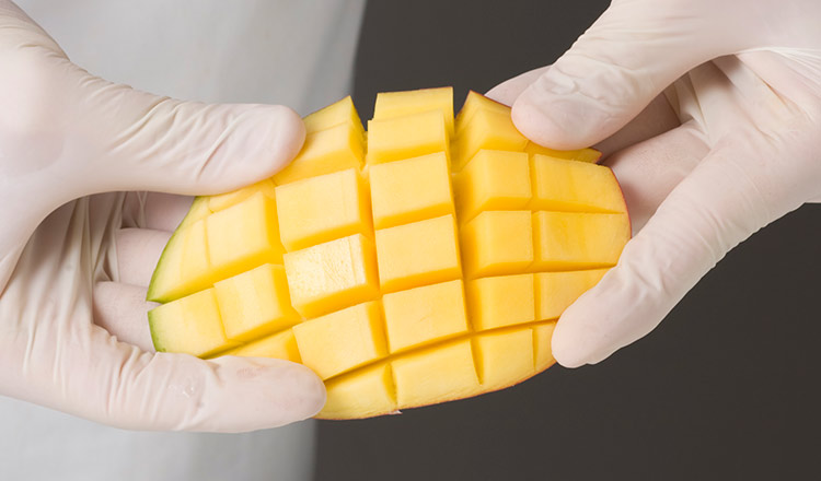 Mango cut into a cross-hatch